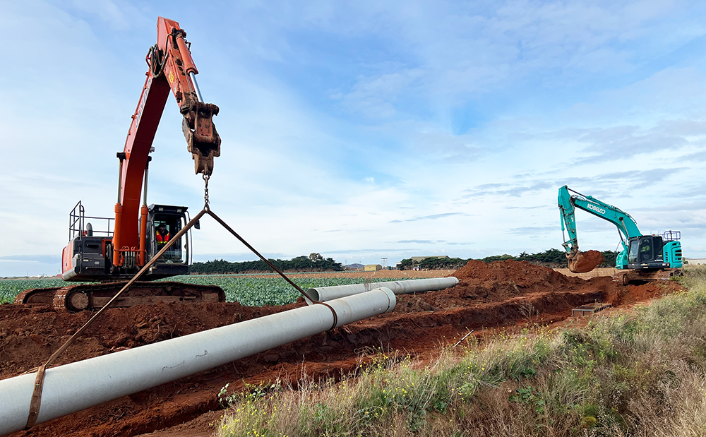 Excavators laying water pipes