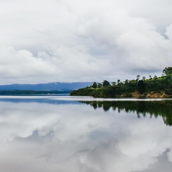 Blue lake with trees on the right side